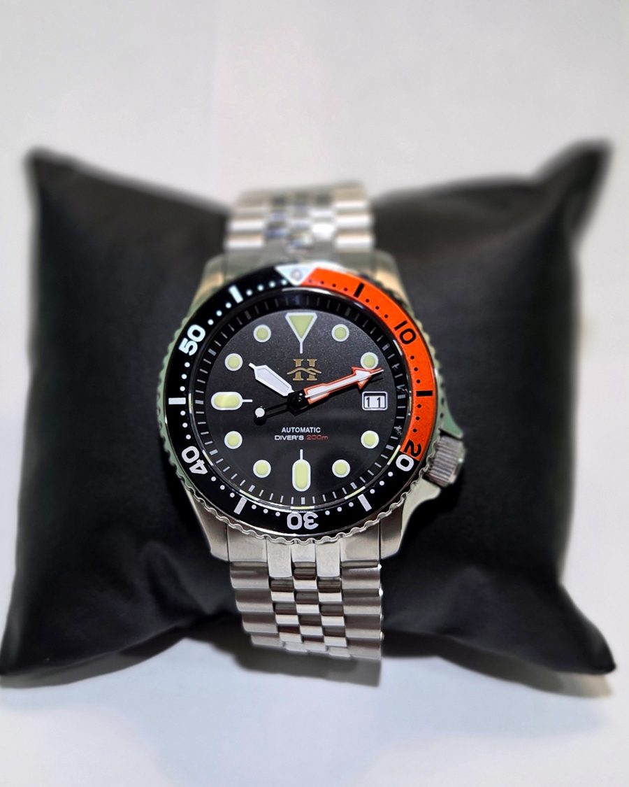 Basecamp diver with an orange and black bezel