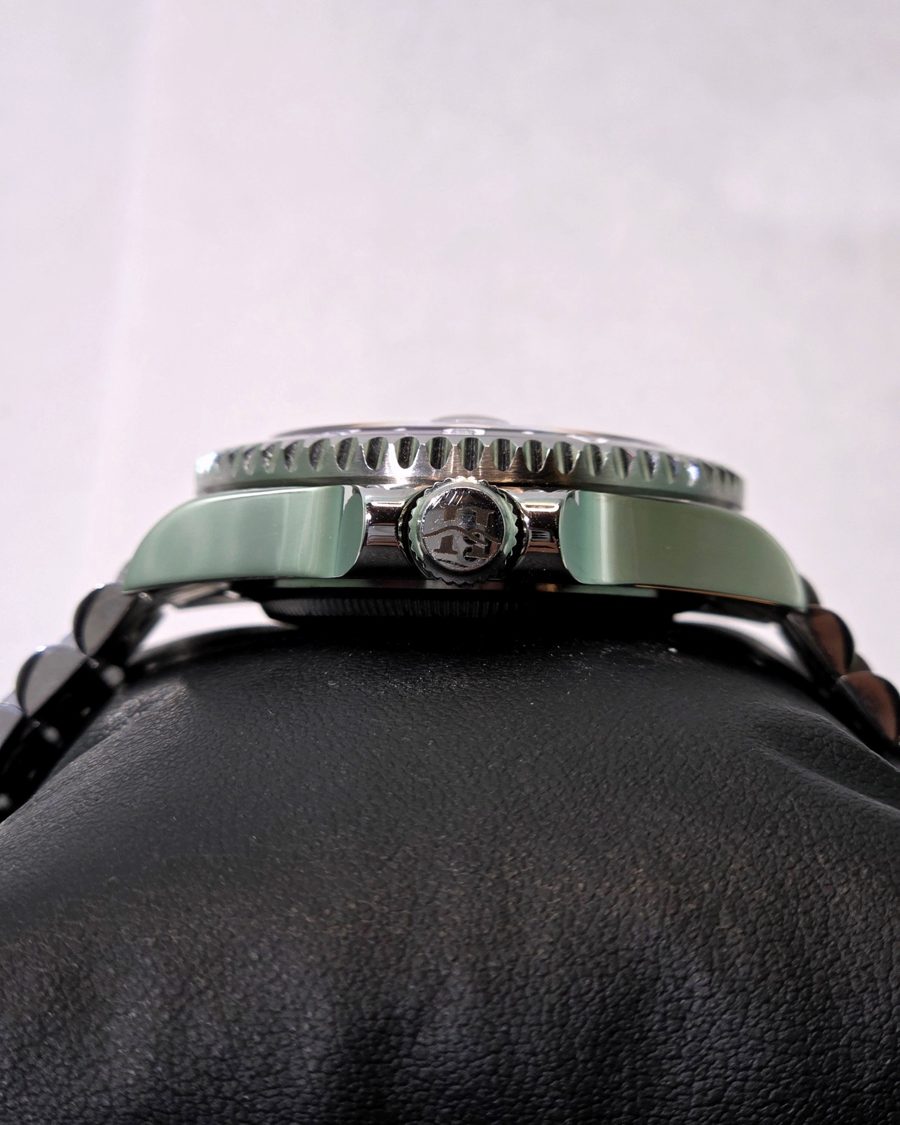 Joker, a watch with a purple sunburst dial and a 24-hour bezel